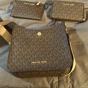 Michael Kors crossbody, zip card wallet, and small zip wallet.